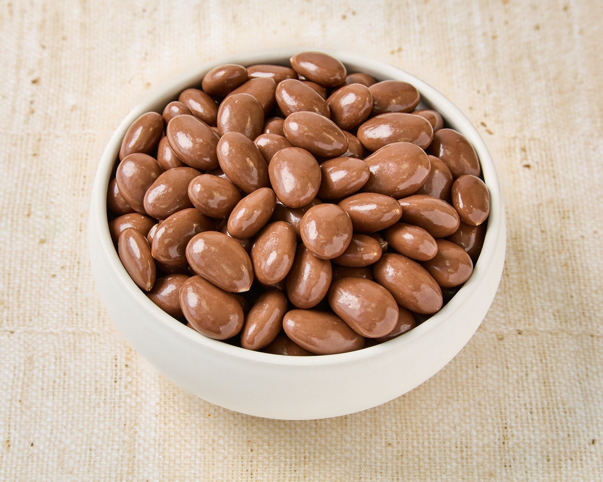 Almonds covered in milk chocolate and coconut