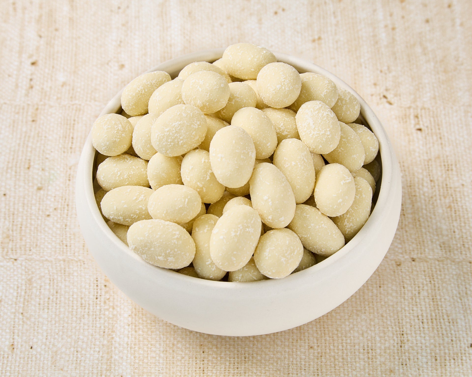 Almonds dipped in white chocolate and coconut