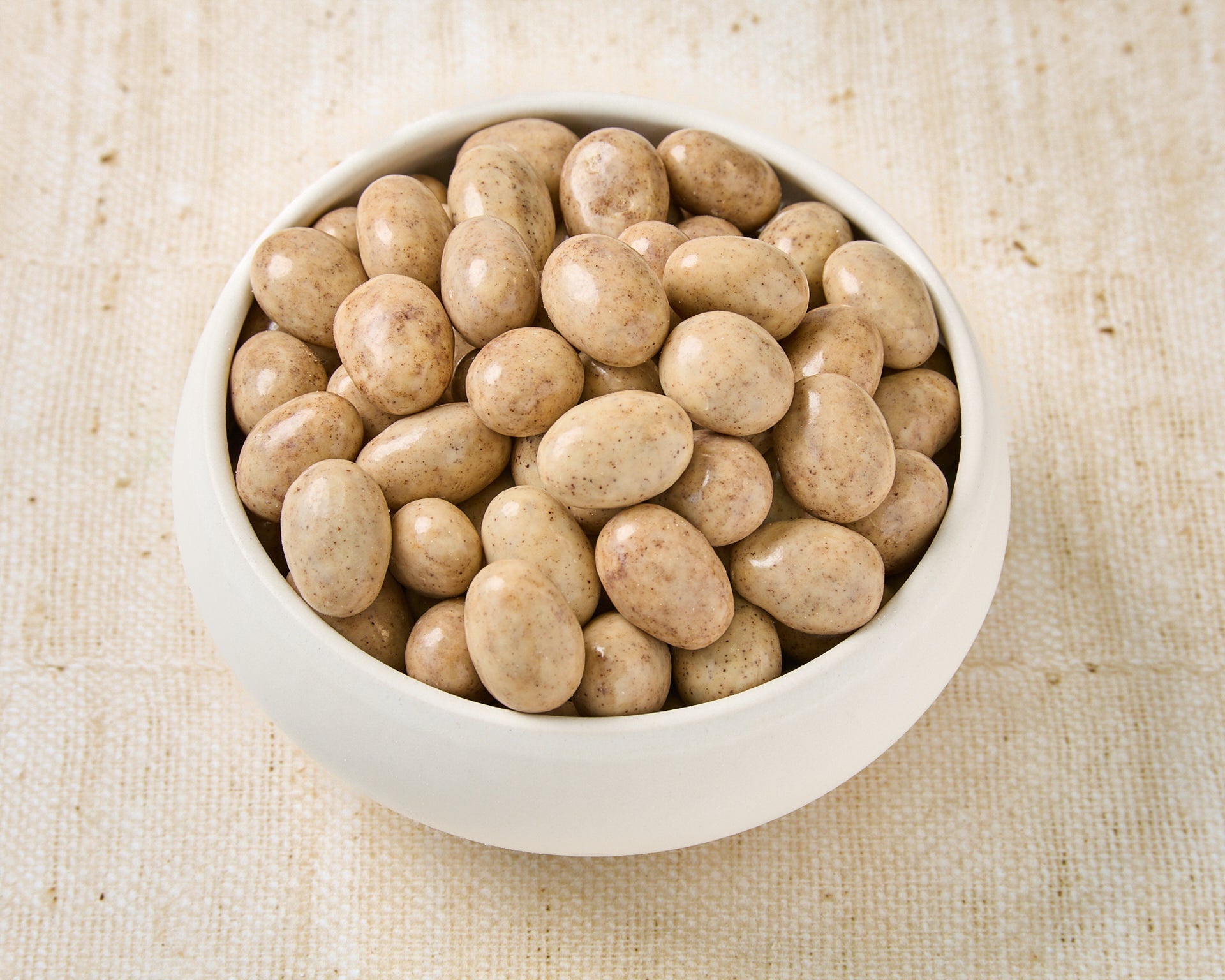 Almonds dipped in white chocolate and coffee