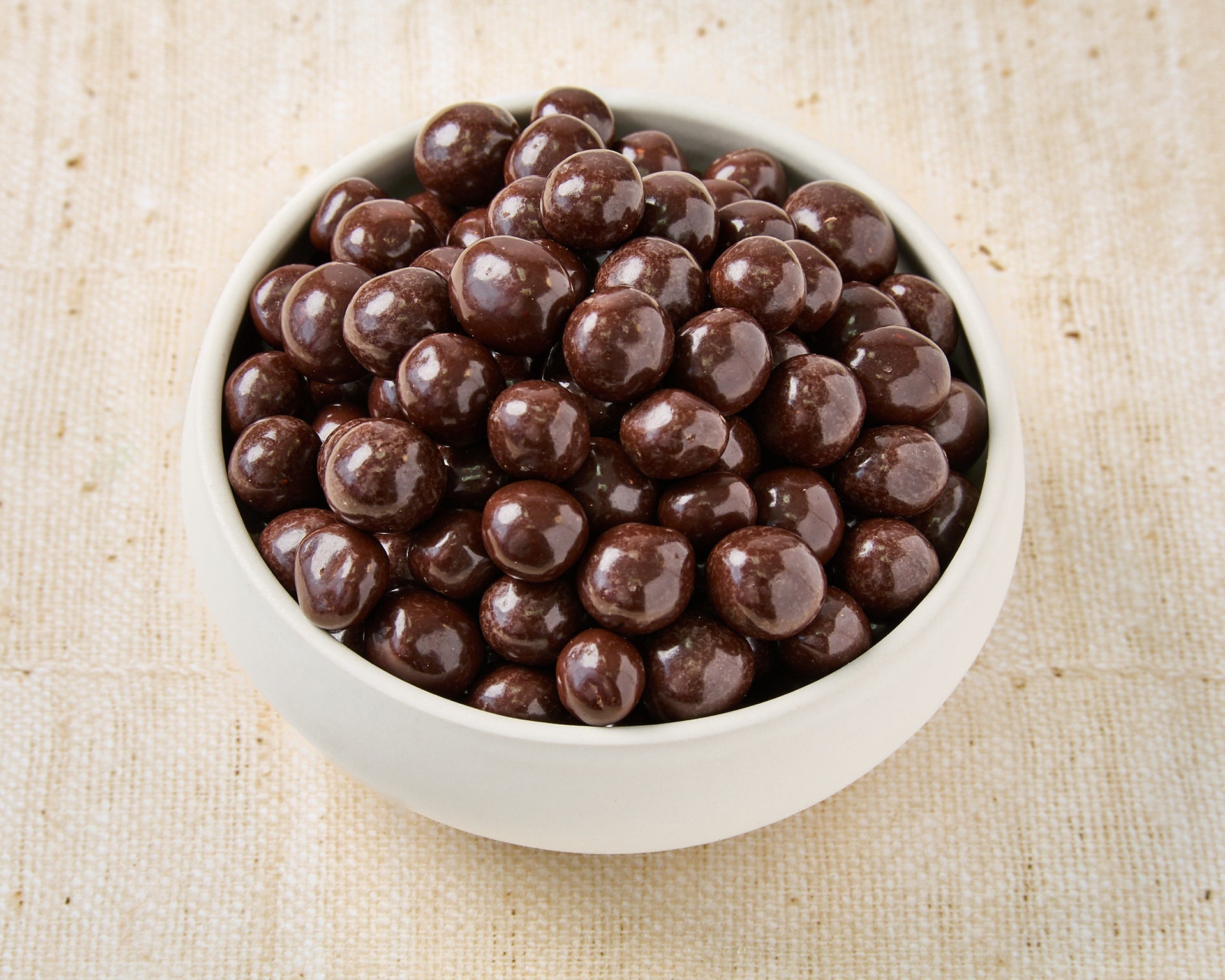 Hazelnuts dipped in dark chocolate